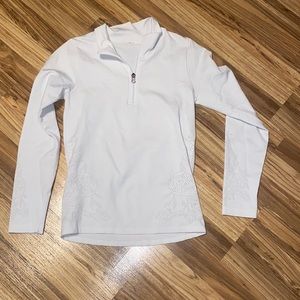 White workout top with designs and quarter zip
